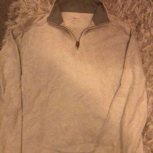 A cream color pull over sweater for men